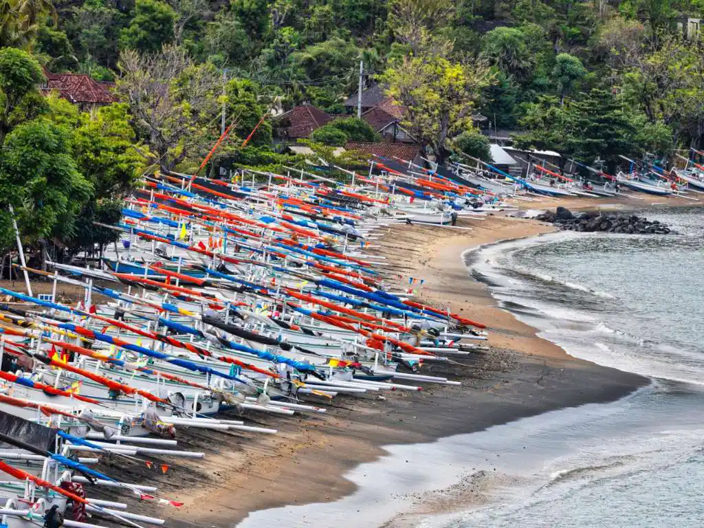 Tuba fishing village beach with traditional boats, off the tourist trail Bali