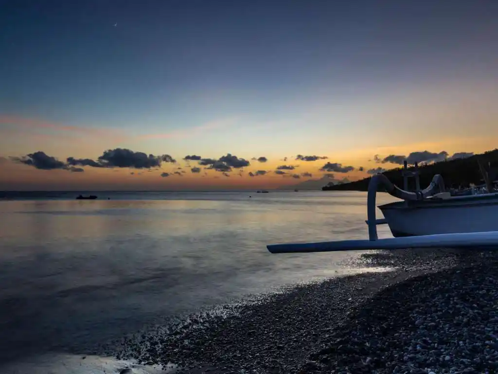 Lean fishing village beach with traditional boats, Amed coast Bali